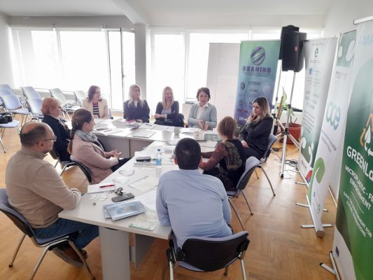 A group of people sitting around a table

AI-generated content may be incorrect.